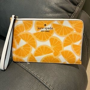 Kate Spade wristlet. Never used. Brand new w/o tags.